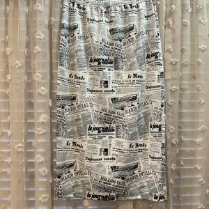 ‘NUGGLES Newspaper Print Skirt